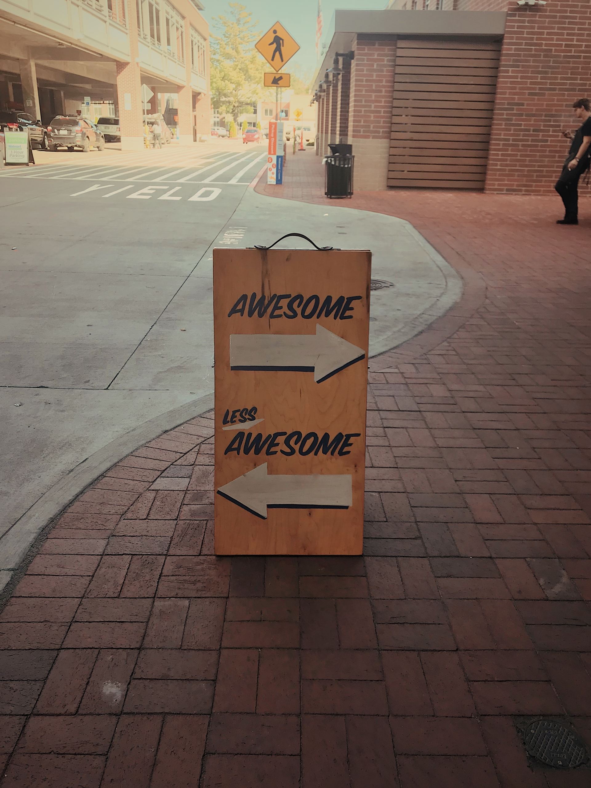 a frame signpost saying awesome and less awesome