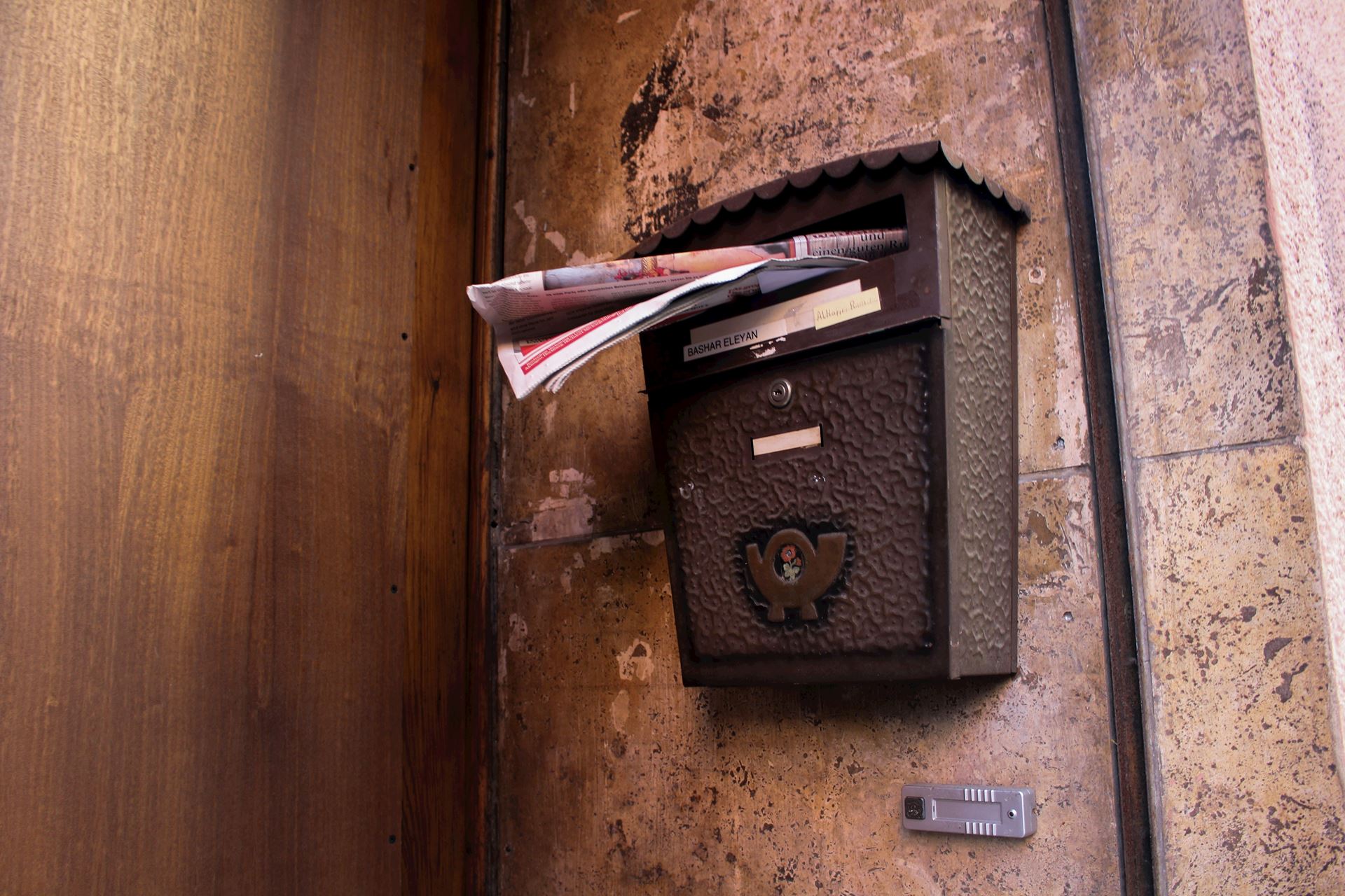 black letterbox with post sticking out